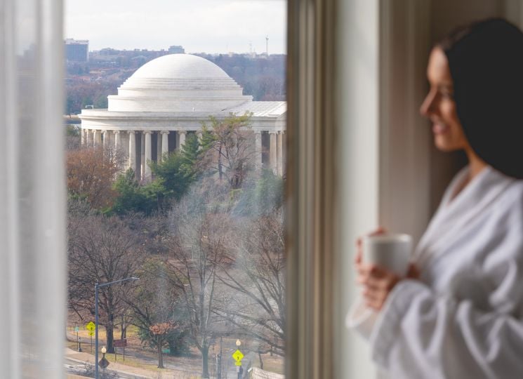 Woman in a robe with a cup of coffee