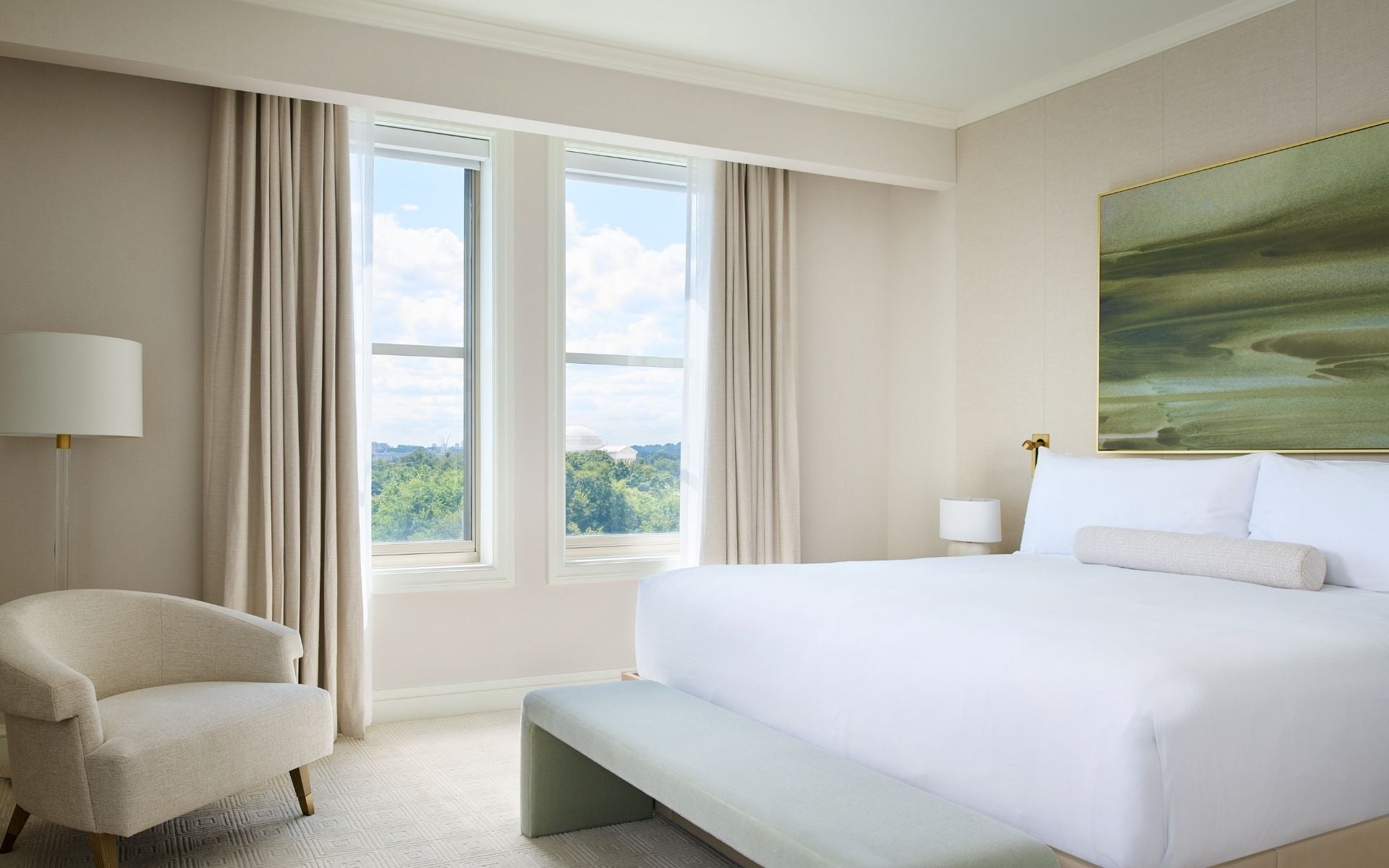 a plush king bedroom with a view