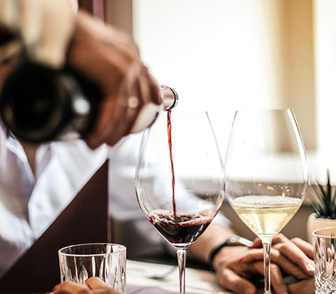 server pouring a drink