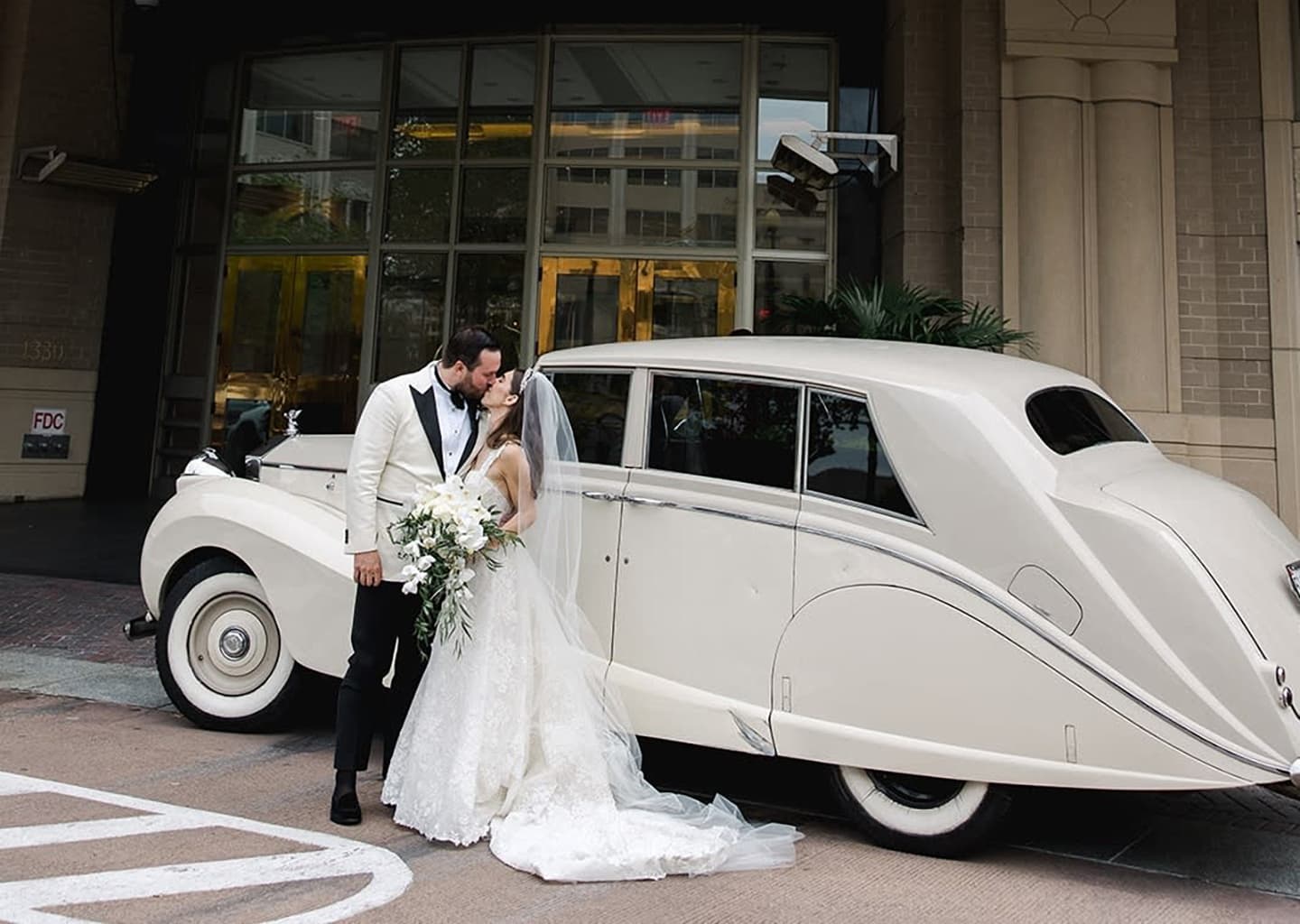 A wedding couple sharing a kiss