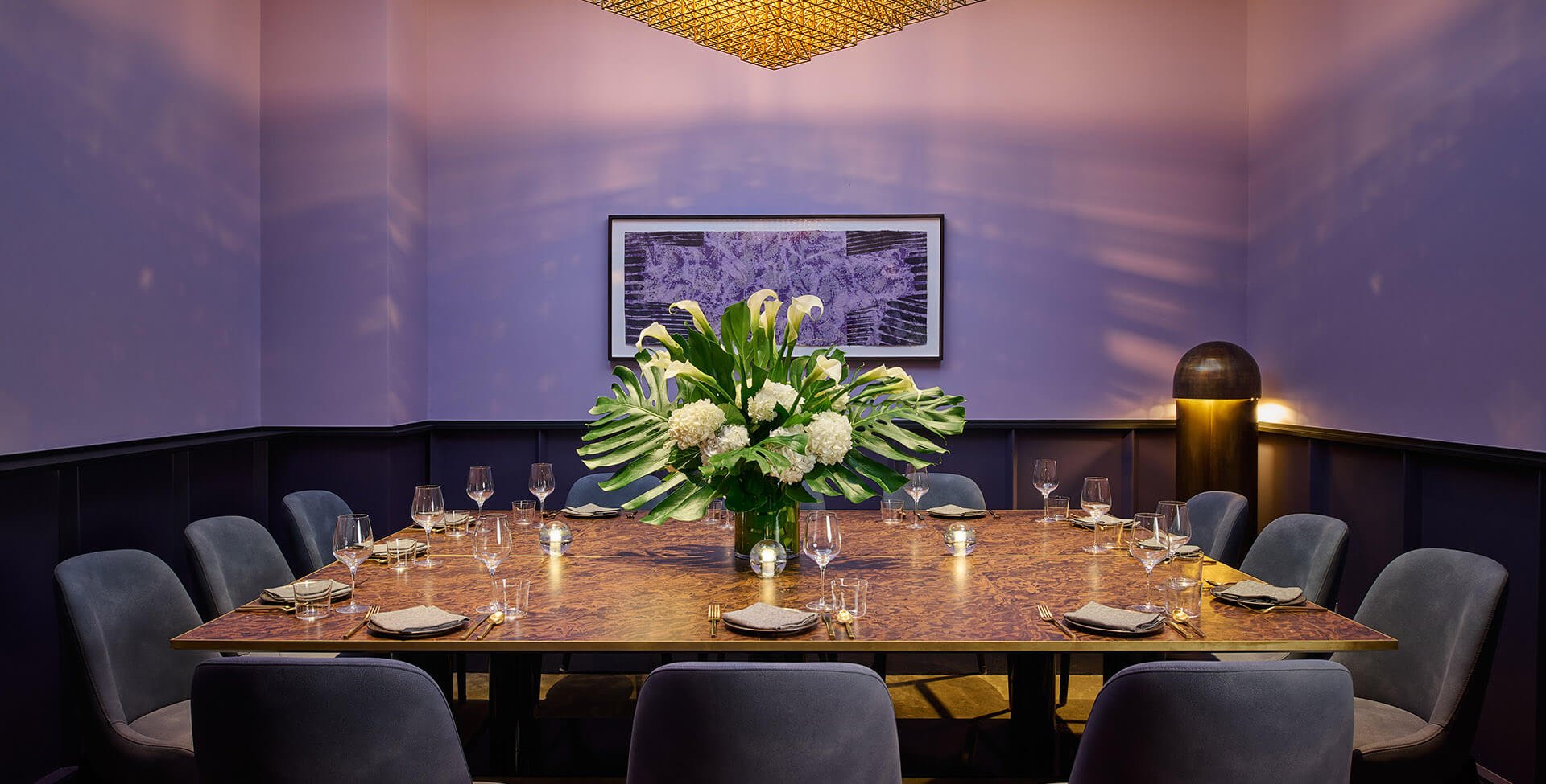 Dogon Banneker Room with seating for 12 and a large floral centerpiece